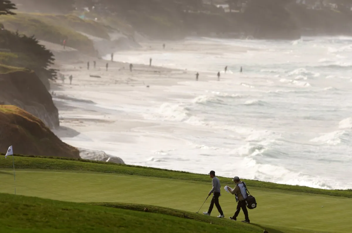 Brandon Wu of the United States walks to the ninth green during a continuation of the third round of the Pebble Beach Pro-Am in Pebble Beach, Calif., on Feb. 5, 2023. (Ezra Shaw/Getty Images)