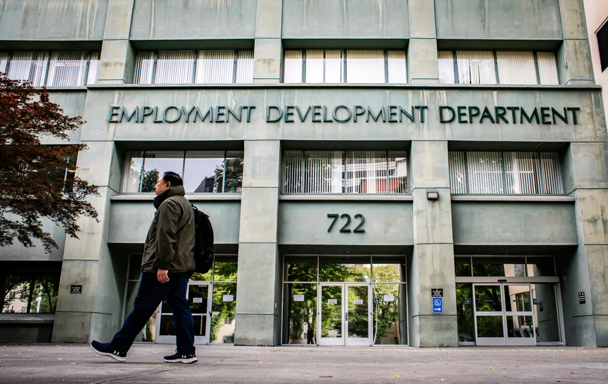People walk past the California Employment Development Department (EDD) in Sacramento, Calif., on April 18, 2022. (John Fredricks/The Epoch Times)