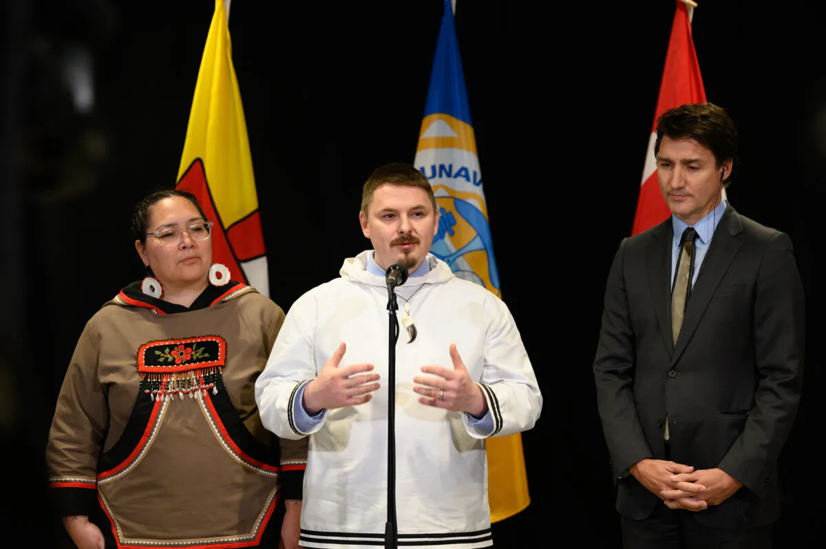 Prime Minister Justin Trudeau, Nunavut Premier P.J. Akeeagok (C), and Nunavut Tunngavik President Aluki Kotierk (L) answer questions at a press conference following the signing of the Nunavut devolution agreement in Iqaluit, on Jan. 18, 2024. (THE CANADIAN PRESS/Dustin Patar)
