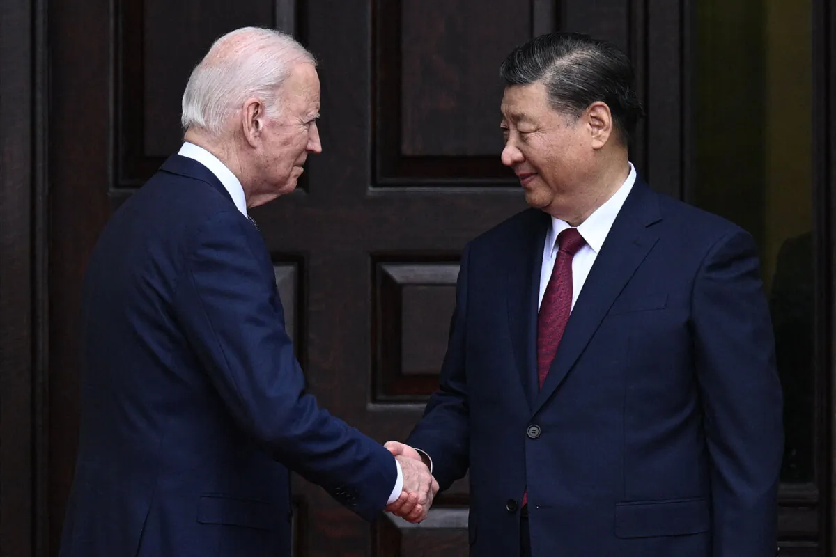 U.S. President Joe Biden greets Chinese leader Xi Jinping before a meeting during the Asia-Pacific Economic Cooperation (APEC) Leaders' week in Woodside, Calif., on Nov. 15, 2023. (Brendan Smialowski/AFP via Getty Images)
