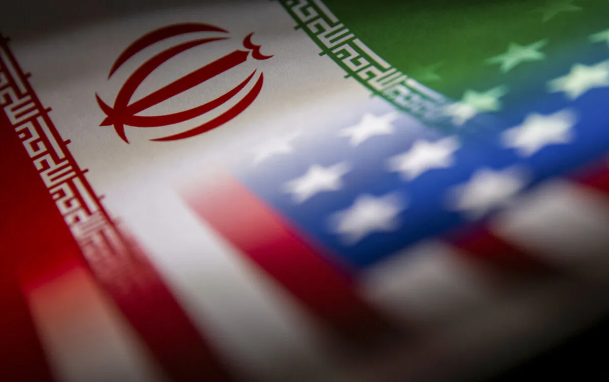 FILE PHOTO: Iran's and U.S.' flags are seen printed on paper in this illustration taken January 27, 2022. REUTERS/Dado Ruvic/Illustration