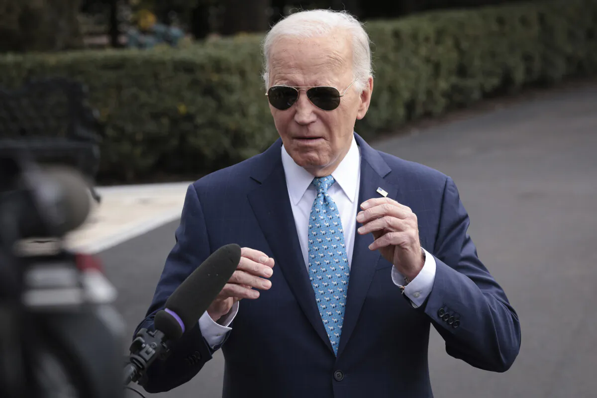 President Joe Biden answers questions while departing the White House in Washington on Jan. 30, 2024. (Win McNamee/Getty Images)