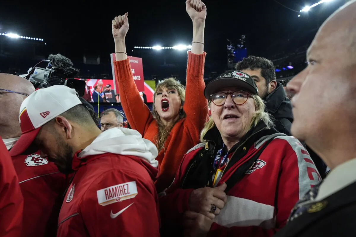 Taylor Swift (C) and Donna Kelce watch the Kansas City Chiefs receive the Lamar Hunt trophy after an AFC Championship NFL football game between the Baltimore Ravens and the Kansas City Chiefs in Baltimore on Jan. 28, 2024. (Julio Cortez/AP Photo)