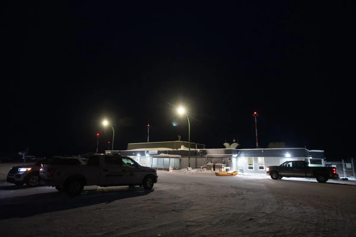 RCMP sit at the airport where six people were killed in a plane crash in Fort Smith, N.W.T., on Jan. 24, 2024. (The Canadian Press/Jason Franson)
