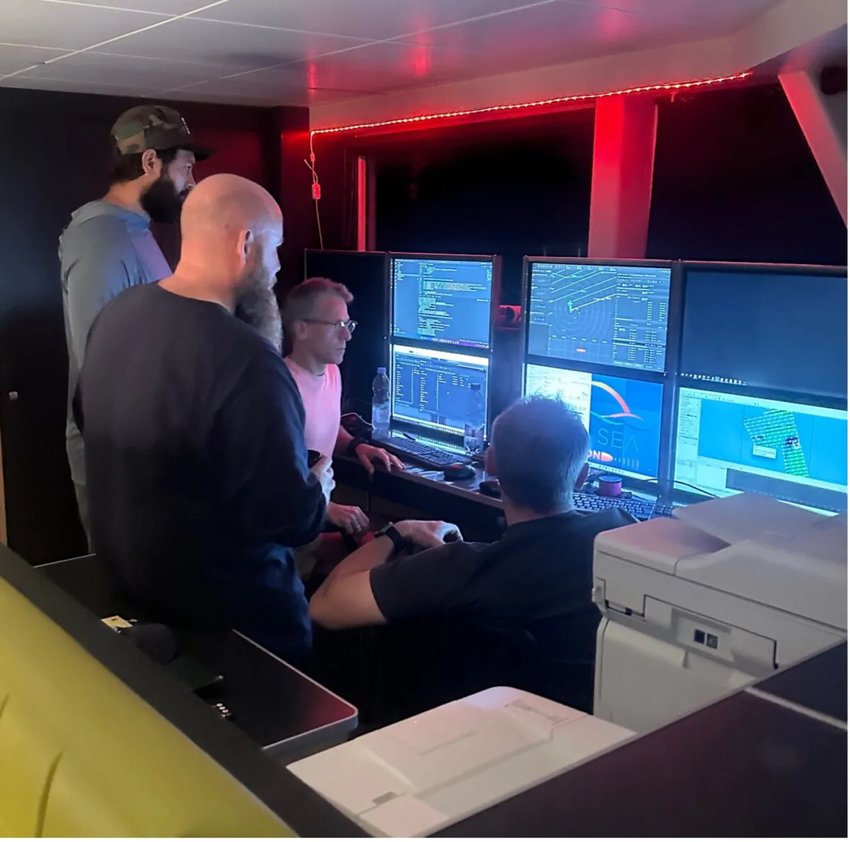 Deep Sea Vision crew members review data collected during their exploration for Amelia Earhart's missing aircraft. (Courtesy Deep Sea Vision)