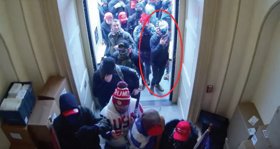 Image from Capitol Building CCTV footage on January 6, 2021, showing Angelo Pacheco standing in the doorway on the Upper West Terrace of the U.S. Capitol Building (July 14, 2023 Statement of Facts).