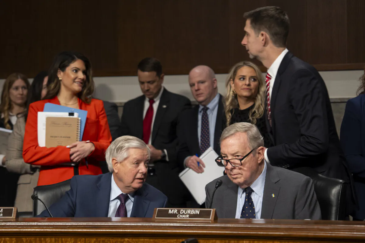 Ranking Member Sen. Lindsey Graham (R-S.C.) (L), Senate Judiciary Committee Chair Sen. Richard Durbin (D-Ill.) (R), and other lawmakers prepare for a hearing with social media CEOs' testimonies in Washington on Jan. 31, 2024. (Madalina Vasiliu/The Epoch Times)