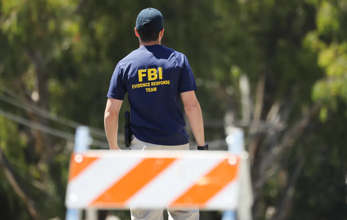 An FBI agent walks toward a crime scene, in this file photo. (Mario Tama/Getty Images)