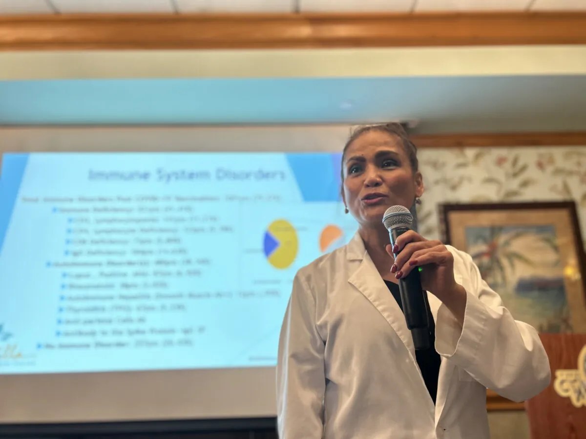 Dr. Marivic Villa presents COVID-19 data for her elderly patients at a press conference at the Waterfront Inn at Sumter Landing in The Villages, Fla., on Jan. 26, 2024. (Patricia Tolson/The Epoch Times)