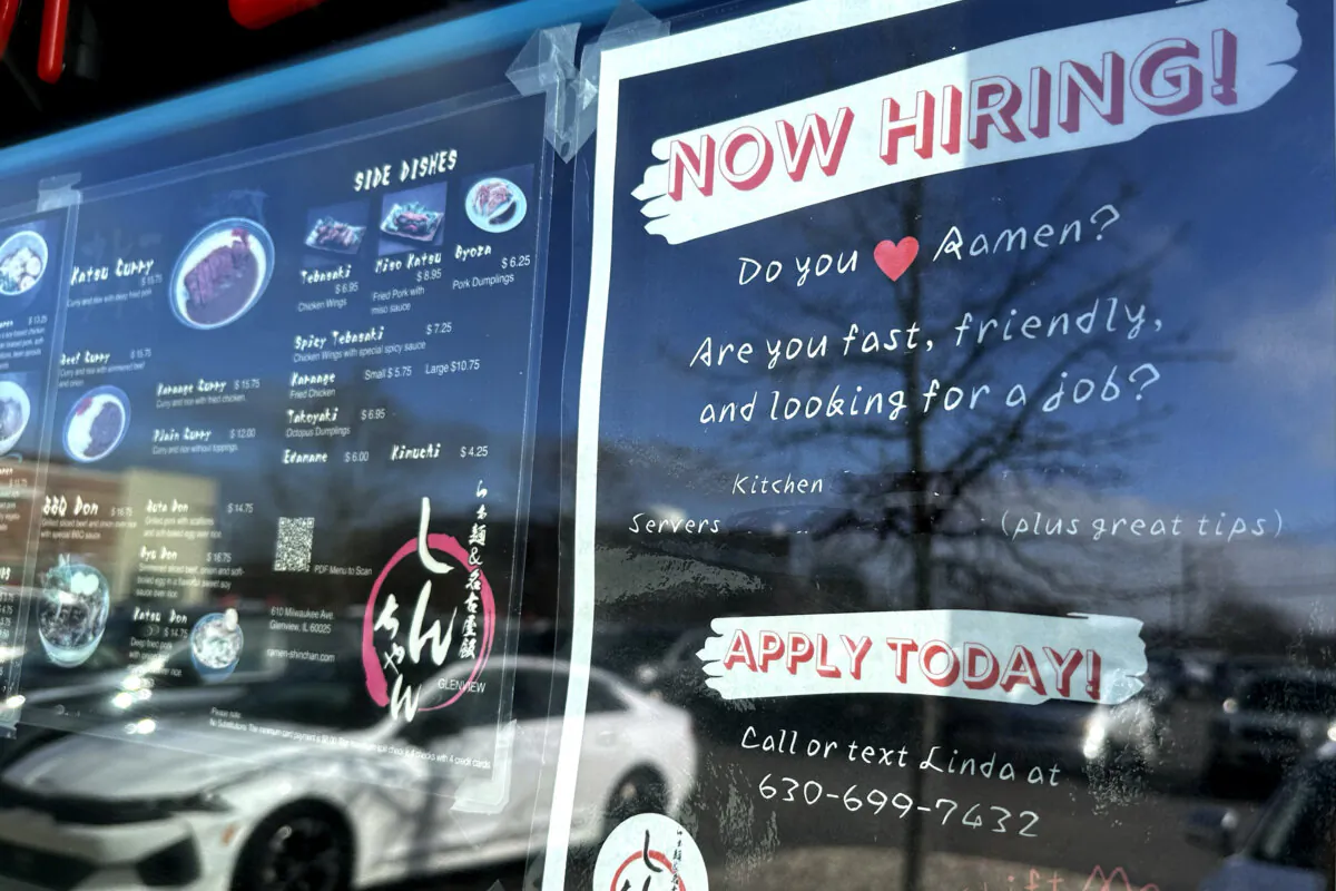A hiring sign is displayed at a restaurant in Glenview, Ill., on Jan. 29, 2024. (Nam Y. Huh/AP Photo)