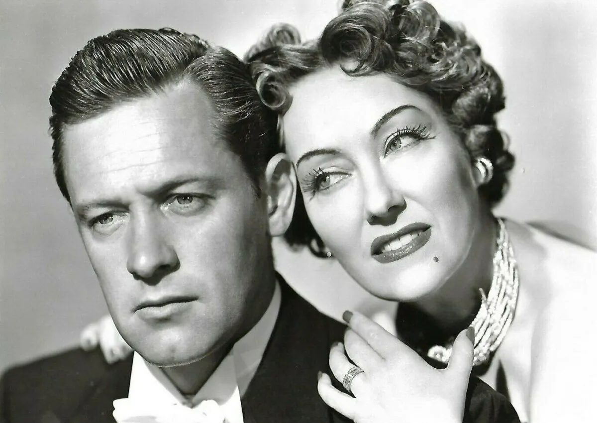 Press photo of William Holden and Gloria Swanson in "Sunset Boulevard" (1950). (Public Domain)