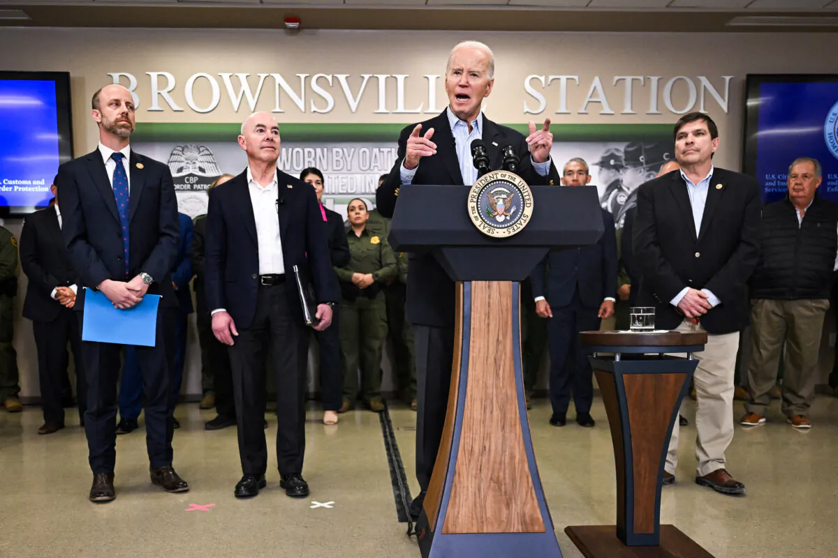 U.S. President Joe Biden (C) flanked by Brownsville, Texas, Mayor John Cowen (L), Homeland Security Secretary Alejandro Mayorkas (2nd L) and Rep. Vicente Gonzalez (D-Texas), speaks about immigration at the Brownsville Station during a visit to the U.S.–Mexico border in Brownsville, Texas, on Feb. 29, 2024. (Jim Watson/AFP via Getty Images)