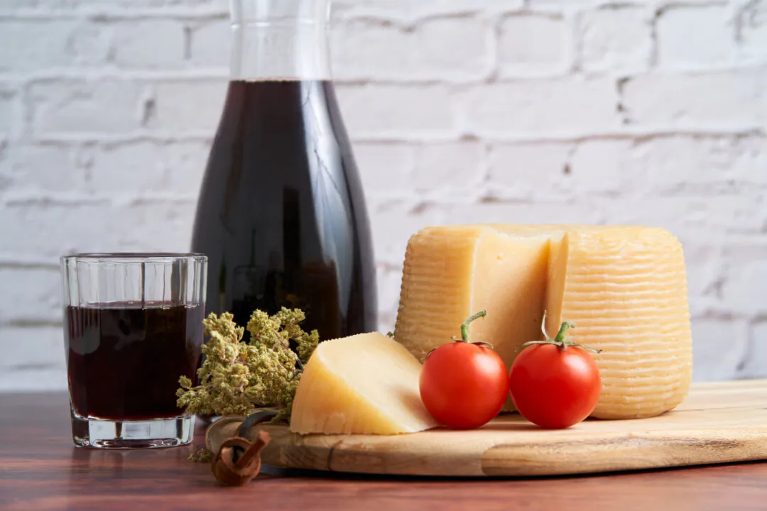 Some foods, such as aged hard cheeses, tomatoes, and red wine, contain high concentrations of histamines. (Franc-o/Shutterstock)