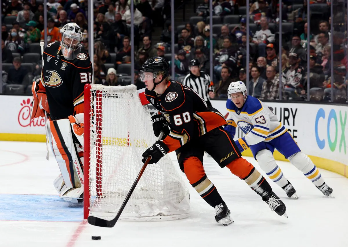 Jackson LaCombe (60) of the Anaheim Ducks starts a rush in front of Jeff Skinner (53) of the Buffalo Sabres as John Gibson (36) looks on during the third period in a Ducks win in Anaheim, Calif., on January 23, 2024. (Harry How/Getty Images)