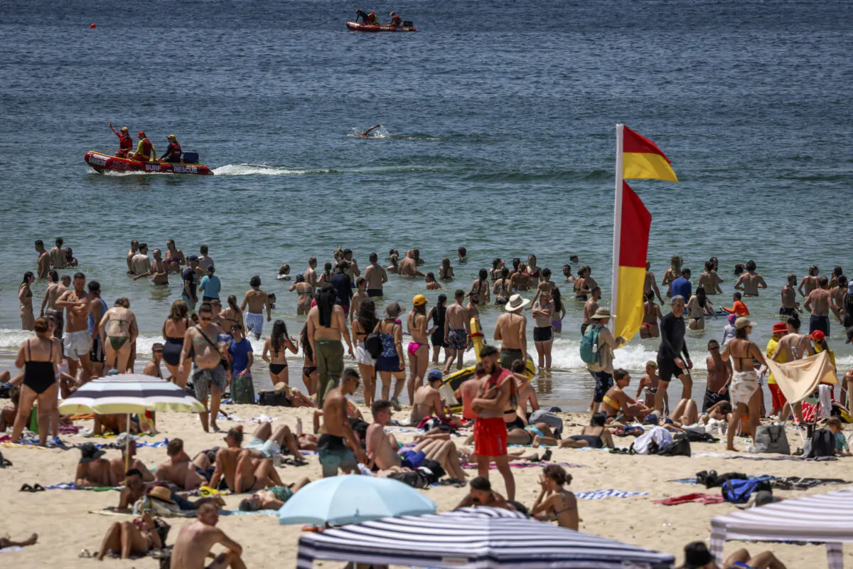 Beachgoers swim on a hot summer day at Bondi Beach in Sydney, Australia, on Dec. 9, 2023. (David Gray/AFP via Getty Images)