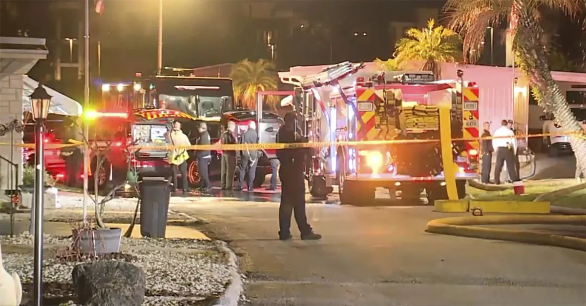 In this image made from video, fire engine, firefighters and other officials are seen inside police tape on scene of a small plane crash in Clearwater, Fla., on Feb. 1, 2024. (WFTS-TV via AP)