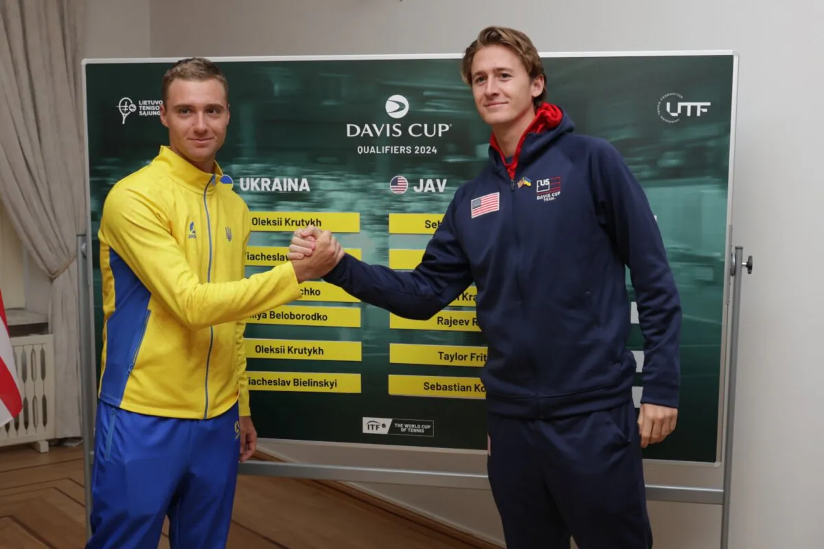 Ukraine’s Oleksii Krutykh (left) and The USA’s Sebastian Korda shake hands following the draw prior to the Davis Cup Qualifier match between Ukraine and USA in Vilnius, Lithuania, on Jan. 31, 2024. (Tim Ireland/Getty Images for ITF)