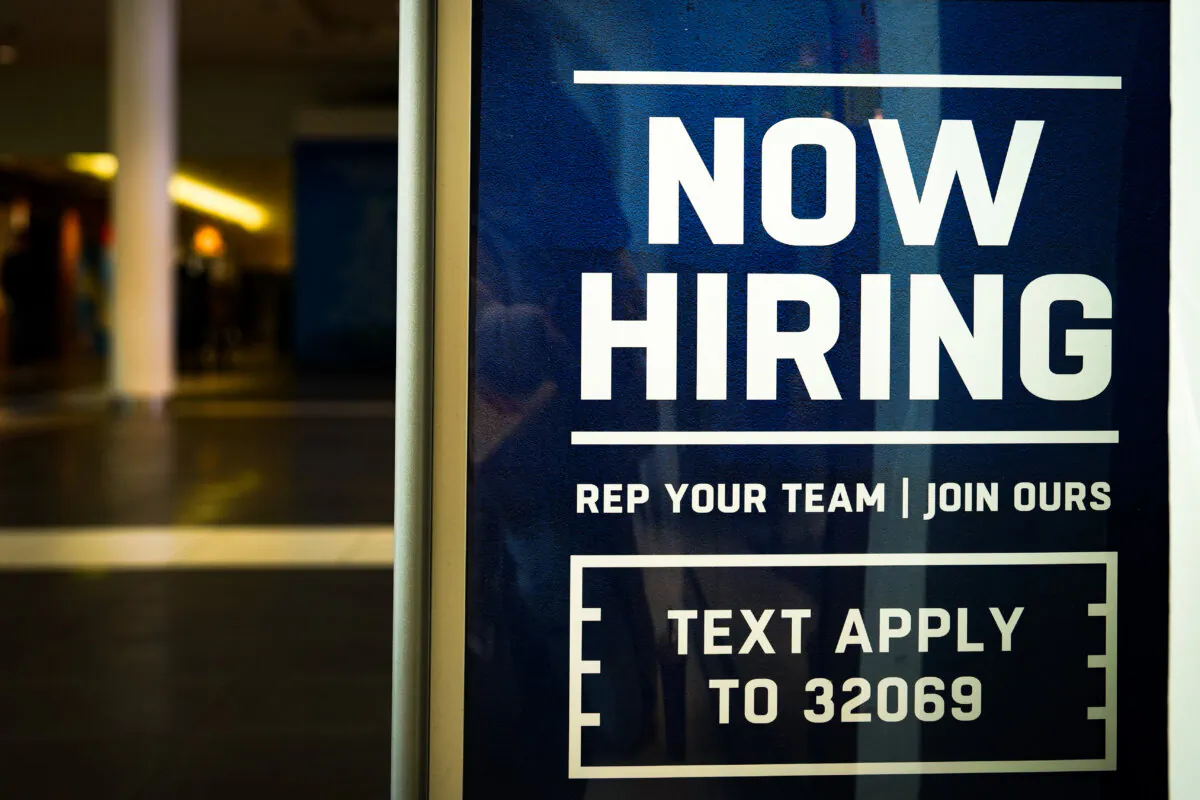 A hiring sign at the Fashion Center at Pentagon City shopping mall in Arlington, Va., on Jan 3, 2024. (Madalina Vasiliu/The Epoch Times)