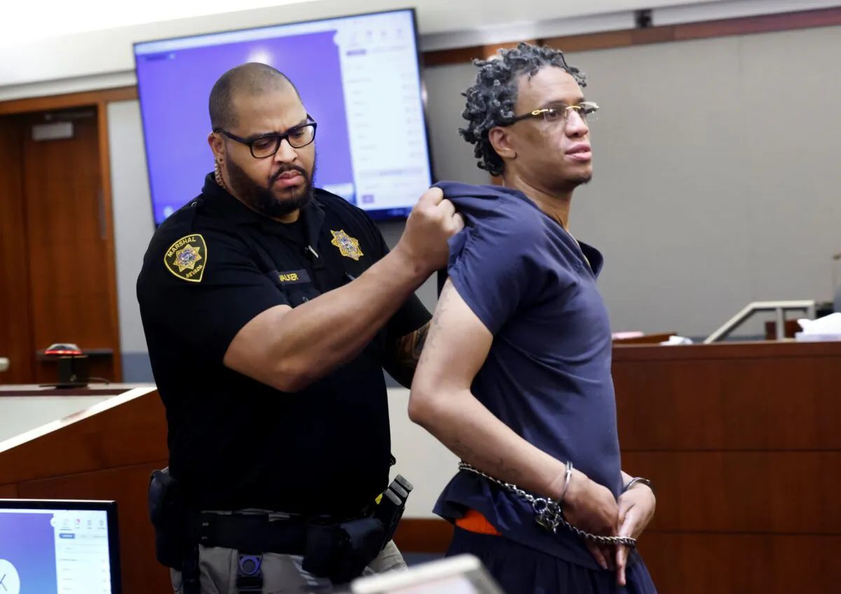 Omar Talley is led out of a courtroom after being disruptive during his sentencing at the Regional Justice Center in Las Vegas, Nev., on Jan. 30, 2024. (Bizuayehu Tesfaye/Las Vegas Review-Journal via AP)