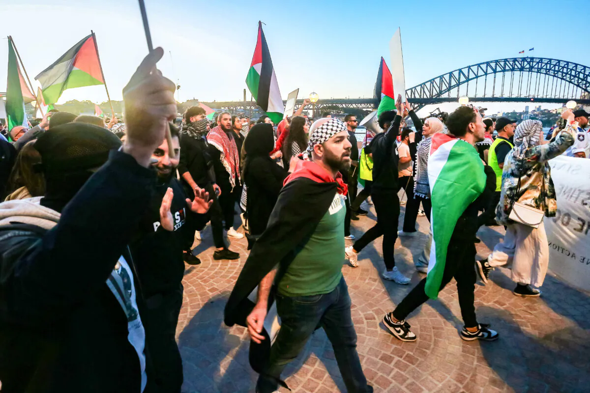 Palestine supporters rally outside the Sydney Opera House on October 09, 2023 in Sydney, Australia. The Palestinian militant group Hamas launched a surprise attack on Israel from Gaza by land, sea, and air, over the weekend, killing over 600 people and wounding more than 2000, agency reports said. Reports also said Israeli soldiers and civilians have been kidnapped by Hamas and taken into Gaza. The attack prompted a declaration of war by Israeli Prime Minister Benjamin Netanyahu, and ongoing retaliatory strikes by Israel on Gaza killing hundreds in the aftermath. (Photo by Lisa Maree Williams/Getty Images)