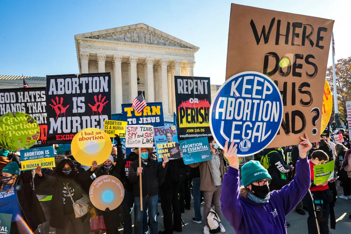 Demonstrators gather in front of the U.S. Supreme Court as the justices hear arguments in Dobbs v. Jackson Women's Health, a case about a Mississippi law that bans most abortions after 15 weeks, in Washington on Dec. 1, 2021. (Chip Somodevilla/Getty Images)