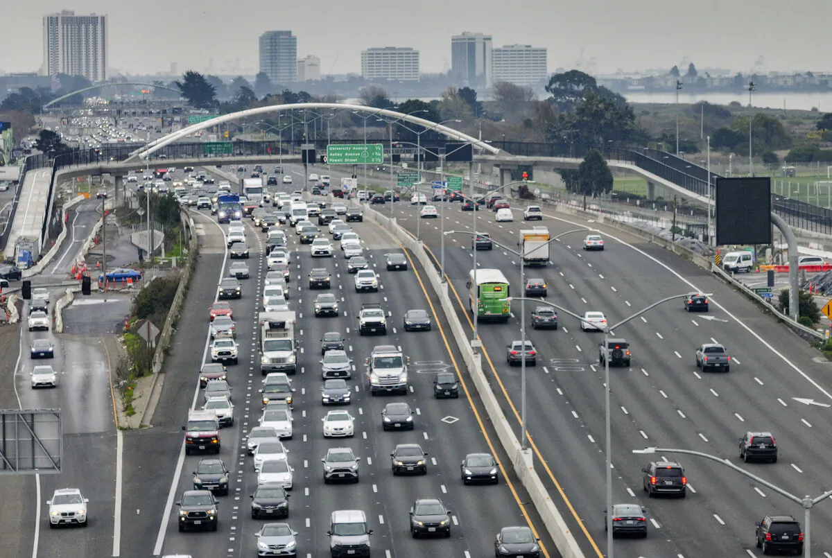 In an aerial view, cars travel along Interstate 80 on Jan. 16, 2024, in Berkeley, Calif. According to a report by the independent research firm Rhodium Group, greenhouse gas emissions fell by nearly 2 percent in 2023. (Photo by Justin Sullivan/Getty Images)