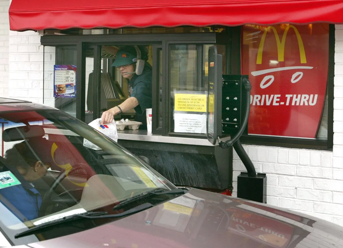 Under Calgary's single-use bylaw, restaurants have to charge customers for getting plastic or paper bags. (Tim Boyle/Getty Images)