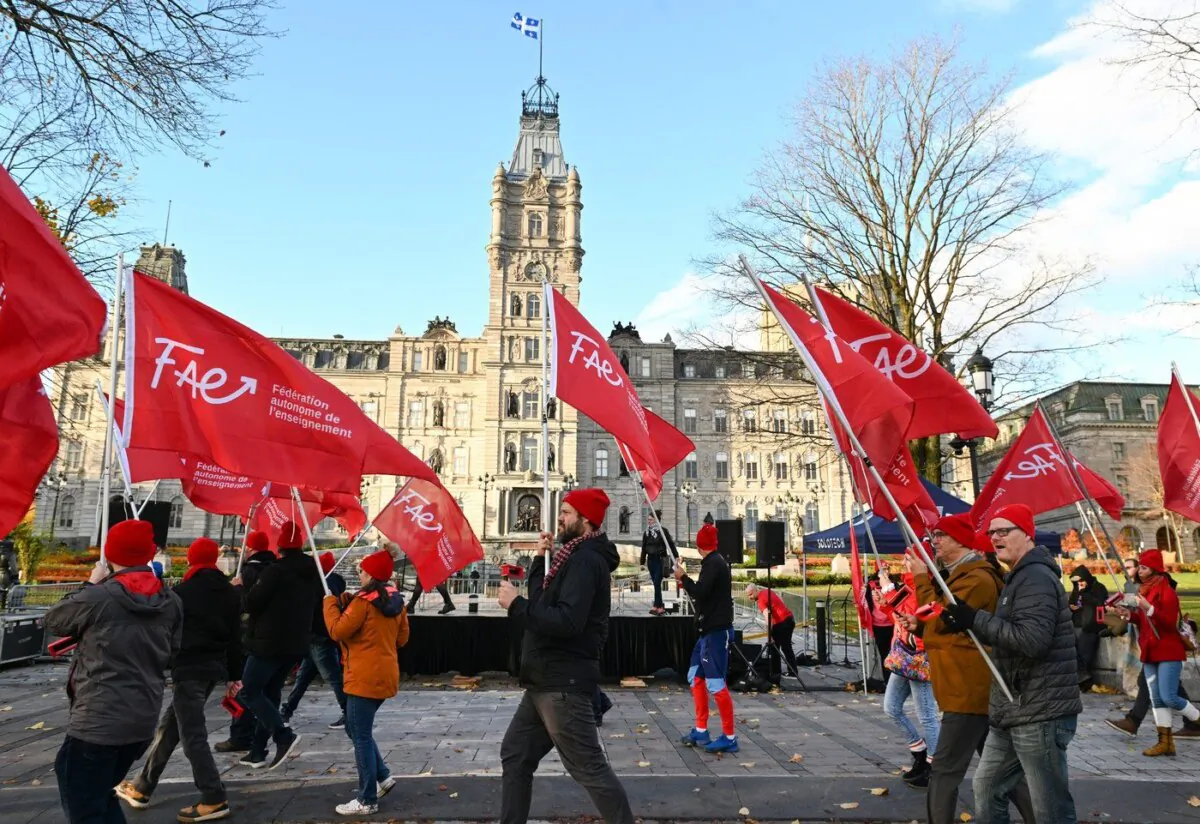 Teachers of the Federation Autonome de l'Enseignement (FAE) march to present their negotiation demands, Oct. 27, 2022, in front of the legislature in Quebec City. (The Canadian Press/Jacques Boissinot)
