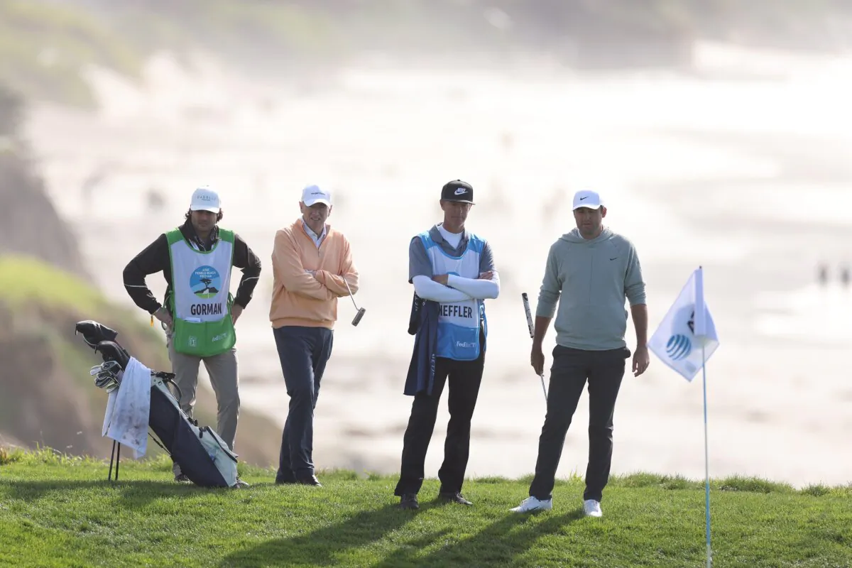Scottie Scheffler of the United States (R) looks on alongside amateur James Gorman during the second round of the Pebble Beach Pro-Am at in Pebble Beach, Calif., on Feb. 2, 2024. (Ezra Shaw/Getty Images)