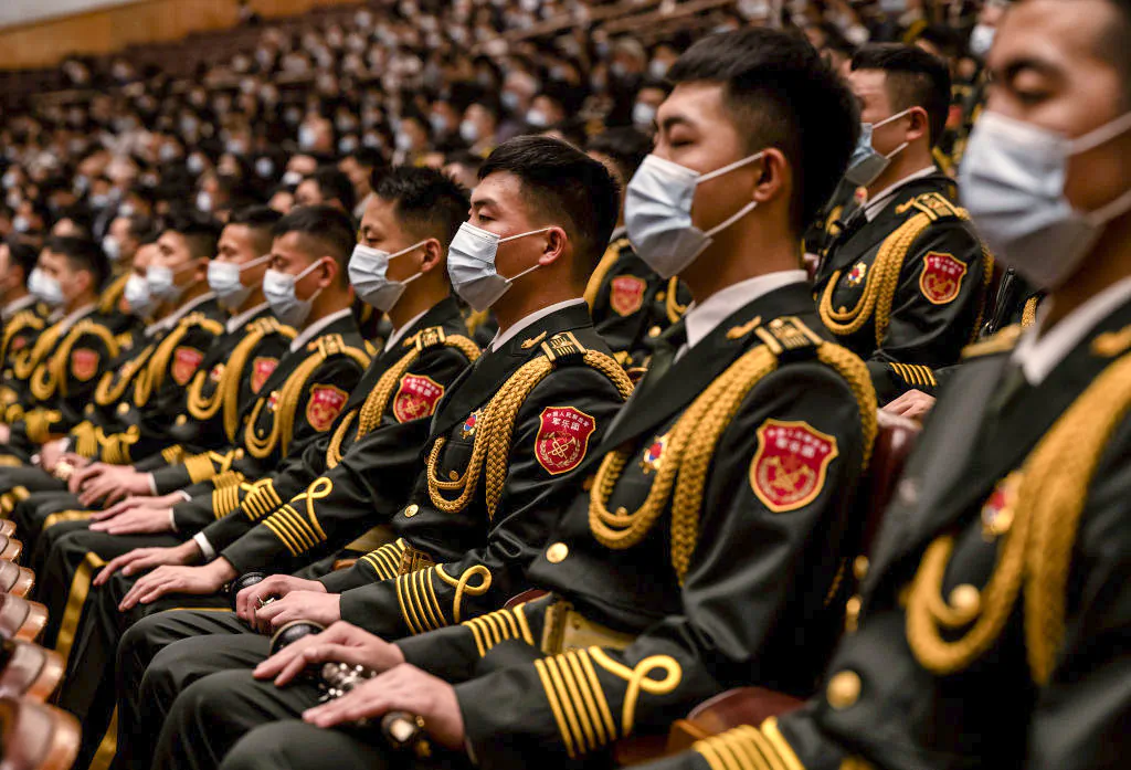 Members of the People's Liberation Army are seated during the Opening Ceremony of the 20th National Congress of the CCP at The Great Hall of People on October 16, 2022 in Beijing, China. Chinese leader Xi Jinping is widely expected to secure a third term in power. (Kevin Frayer/Getty Images)