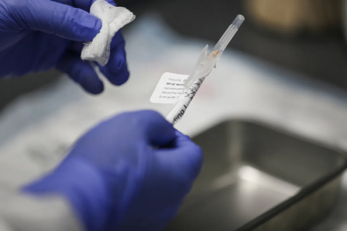 RN Jose Muniz prepares a COVID-19 vaccination at Research Centers of America in Hollywood, Fla., on Aug. 7, 2020. (Joe Raedle/Getty Images)