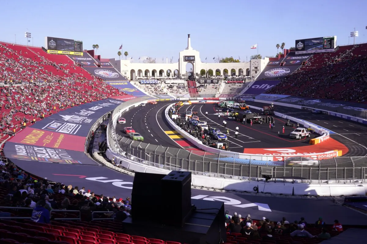 Cars race during the qualifying portion of the Busch Light Clash NASCAR exhibition auto race at Los Angeles Memorial Coliseum in Los Angeles on Feb. 5, 2023. (Mark J. Terrill/AP Photo)
