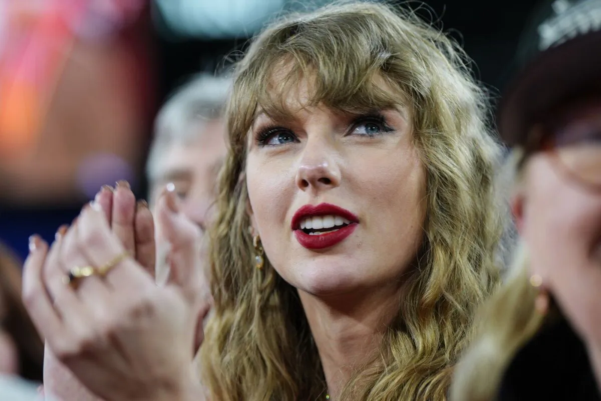 Taylor Swift, who recently became a prominent victim of deepfake pornography, stands on the field after an AFC Championship NFL football game between the Baltimore Ravens and the Kansas City Chiefs, Jan. 28, 2024, in Baltimore. (The Canadian Press/AP-Julio Cortez)
Julio Cortez