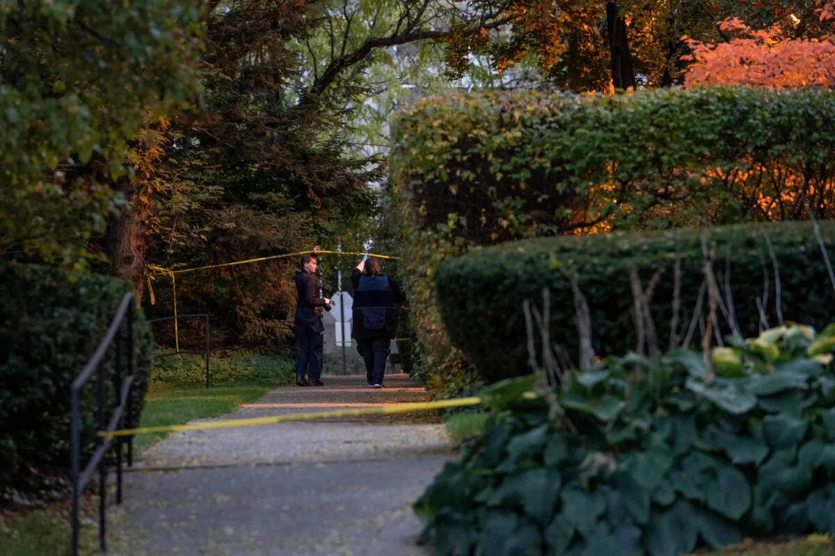 Detroit police officers work near the scene where Isaac Agree Downtown Synagogue president, Samantha Woll, was found dead in Detroit on Oct. 21, 2023. (Sarah Rice/AFP via Getty Images)