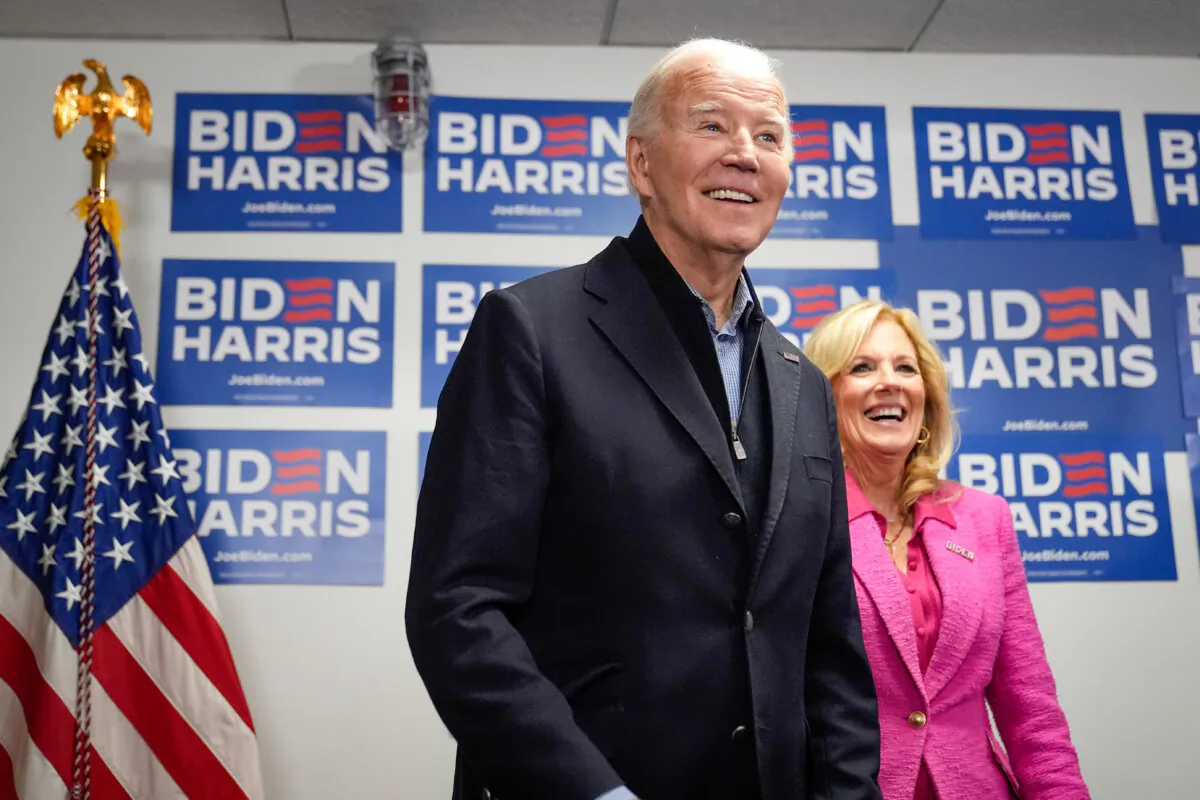 President Joe Biden (L) waits to speak as First Lady Jill Biden looks on at the Biden campaign headquarters in Wilmington, Del., on Feb. 3, 2024. (Alex Brandon/AP Photo)