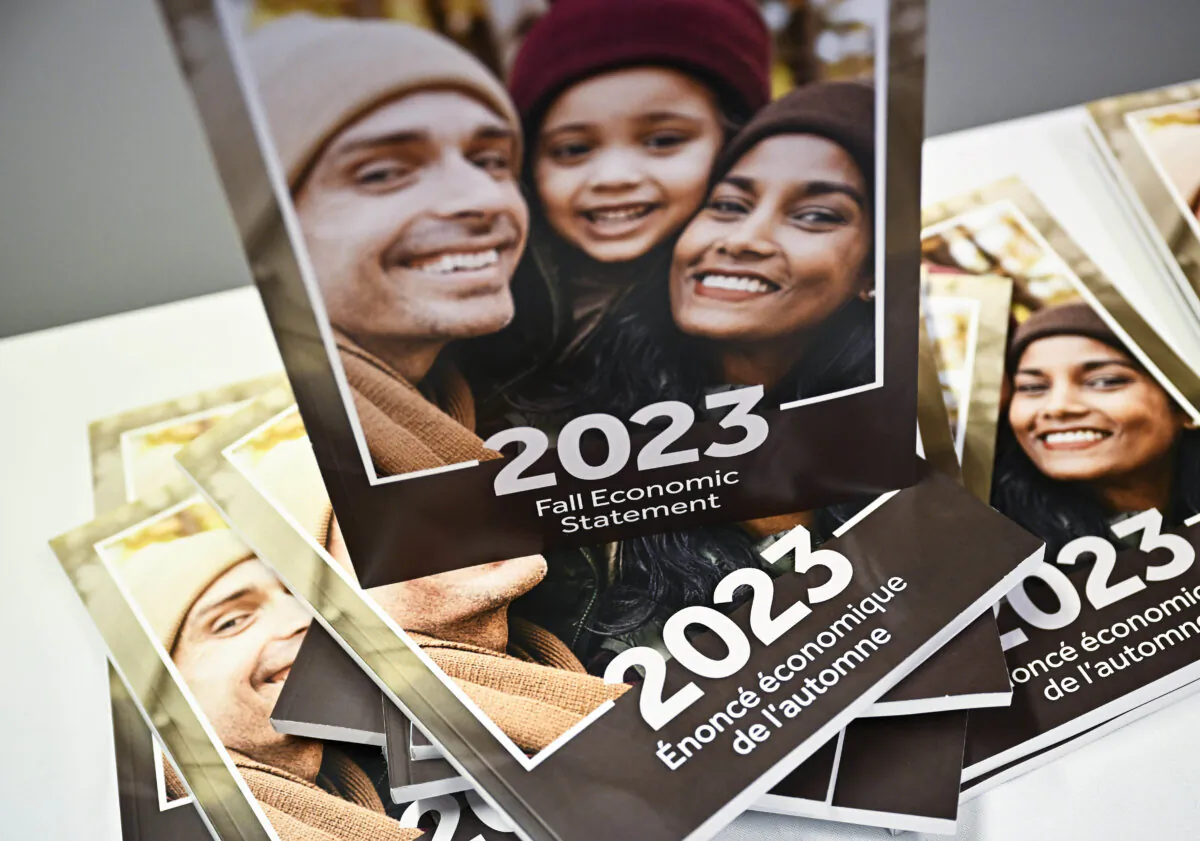 Copies of the “2023 Fall Economic Statement” are seen in the media lockup immediately prior to the release of the statement, in Ottawa on Nov. 21, 2023. (The Canadian Press/Justin Tang)