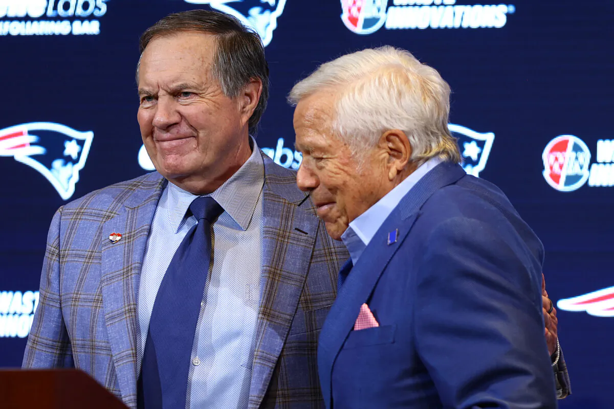 Owner Robert Kraft (R) hugs head coach Bill Belichick (L) of the New England Patriots during a press conference at Gillette Stadium in Foxborough, Mass., on Jan. 11, 2024. (Maddie Meyer/Getty Images)