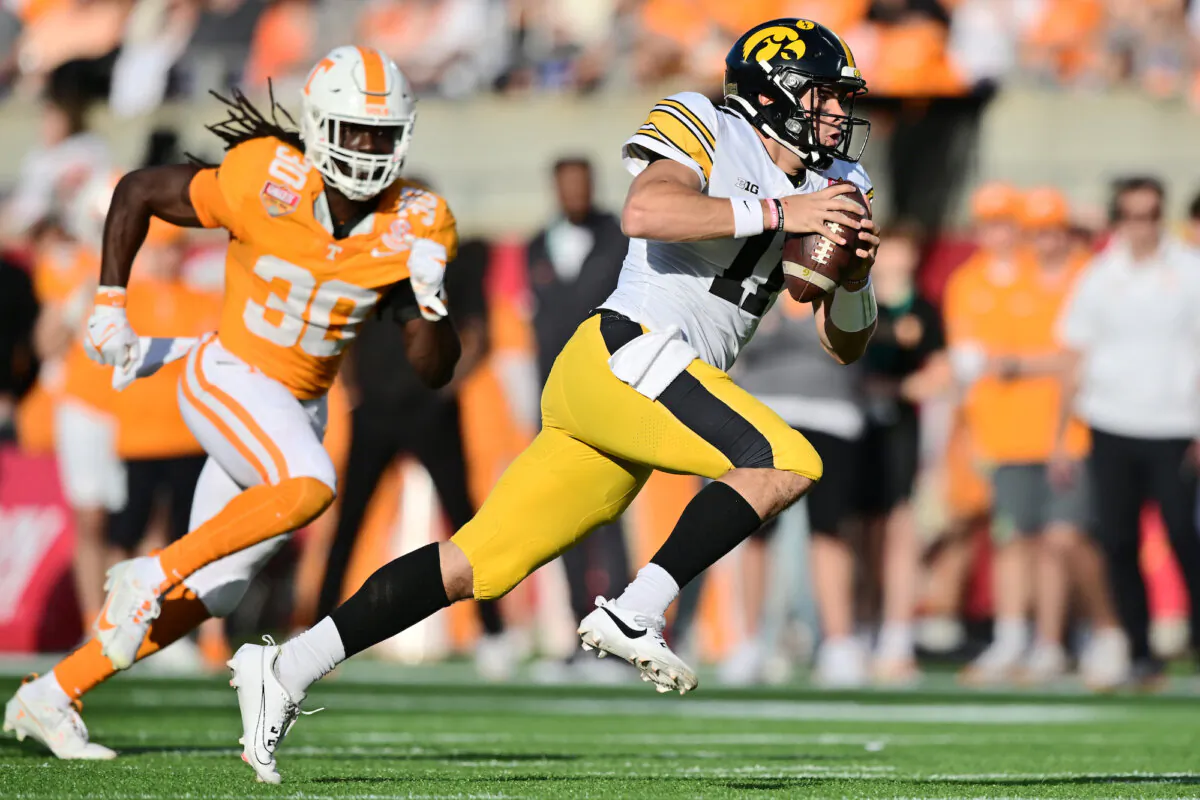 Marco Lainez #11 of the Iowa Hawkeyes rushes the ball in the fourth quarter against the Tennessee Volunteers during the 2024 Cheez-It Citrus Bowl at Camping World Stadium on Jan. 1, 2024, in Orlando, Fla. (Julio Aguilar/Getty Images)