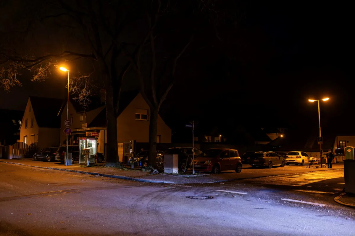 The light of a car illuminates the spot where a carnival float caught fire in the afternoon, in Kehl, Germany, on Feb. 4, 2024. (Philipp von Ditfurth/dpa via AP)