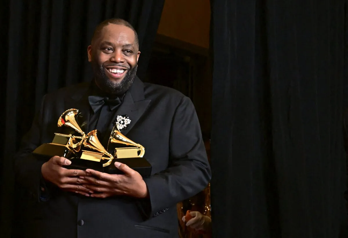 U.S. rapper Killer Mike poses in the press room with the Grammy for Best Rap Performance, Best Rap Album, and Best Rap Song during the 66th Annual Grammy Awards at the Crypto.com Arena in Los Angeles on Feb. 4, 2024. (Frederic J. Brown/AFP via Getty Images)
