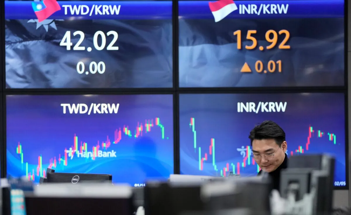 A currency trader watches monitors at the foreign exchange dealing room of the KEB Hana Bank headquarters in Seoul, South Korea, on Feb. 5, 2024. (Ahn Young-joon/AP Photo)