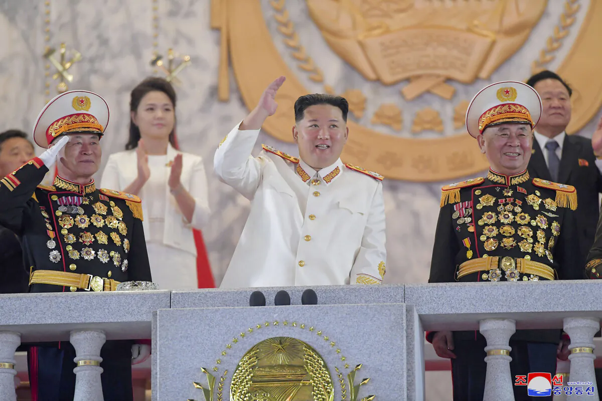 North Korean leader Kim Jong Un (C) watches a military parade to mark the 90th anniversary of North Korea's army at the Kim Il Sung Square in Pyongyang, North Korea Monday, on April 25, 2022. (KCNA/Korea News Service via AP)