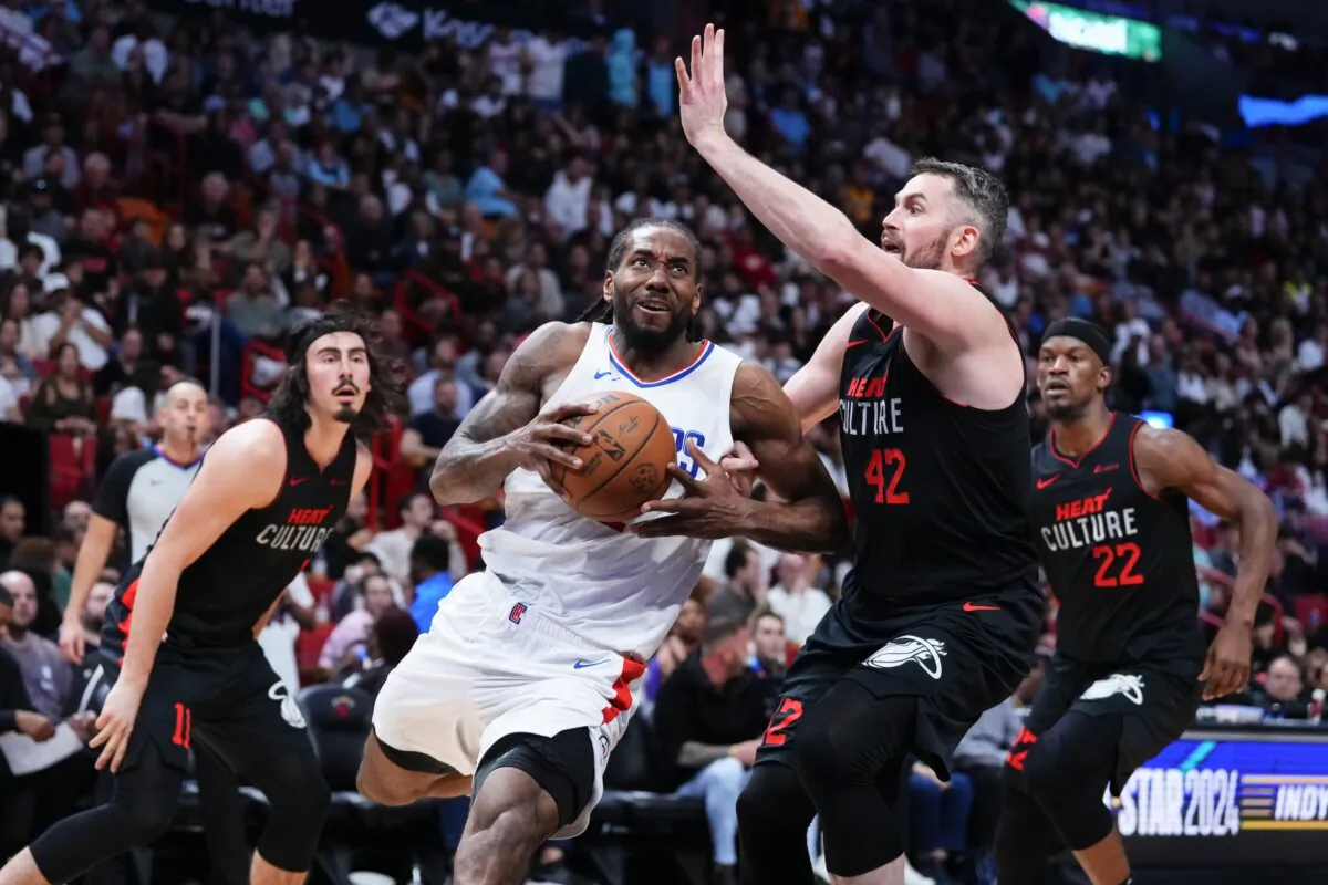 Kawhi Leonard (2) of the LA Clippers drives to the basket against Kevin Love (42) of the Miami Heat during the third quarter in Miami on Feb. 4, 2024. (Rich Storry/Getty Images)