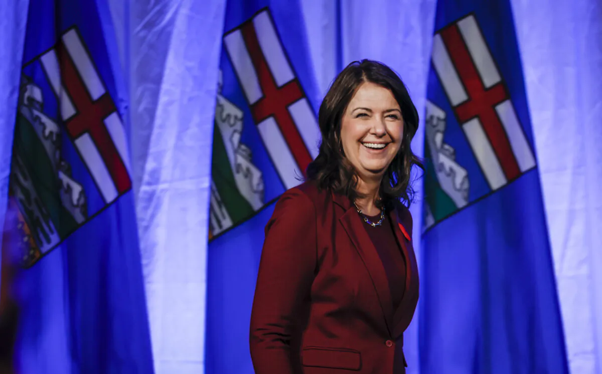 Alberta Premier Danielle Smith smiles as she walks on stage to address party faithful at the United Conservative Party annual general meeting in Calgary, on Nov. 4, 2023. (The Canadian Press/Jeff McIntosh)