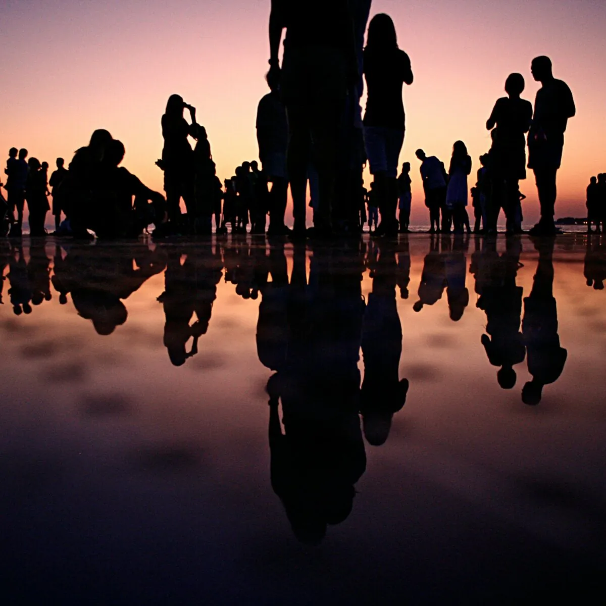 A silhouette of people standing during the golden hour, in a file photo. (Mario Purisic/Unsplash.com)
