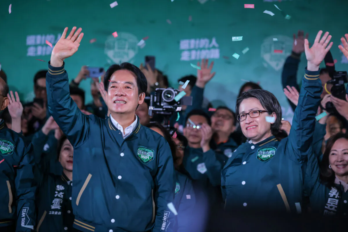 Confetti flies over the stage and crowd as Taiwan's Vice President and presidential-elect from the Democratic Progressive Party (DPP) Lai Ching-te (Centre L) and his running mate Hsiao Bi-khim (Centre R) speak to supporters at a rally at the party's headquarters on January 13, 2024 in Taipei, Taiwan. (Annabelle Chih/Getty Images)