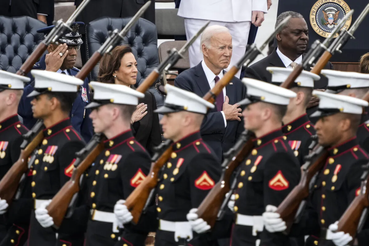 (L-R) Chairman of the Joint Chiefs of Staff Gen. Charles Q. Brown Jr., Vice President Kamala Harris, President Joe Biden, and Secretary of Defense Lloyd Austin stand as troops depart Summerall Field at Joint Base Myer-Henderson Hall, in Arlington, Va., on Sept. 29, 2023. (Drew Angerer/Getty Images)