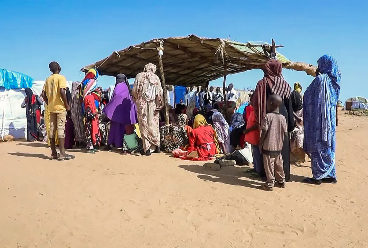 Sudanese refugees gather outside a field hospital in Acre, Chad, on Aug. 15, 2023. (The Canadian Press/AP Photo)