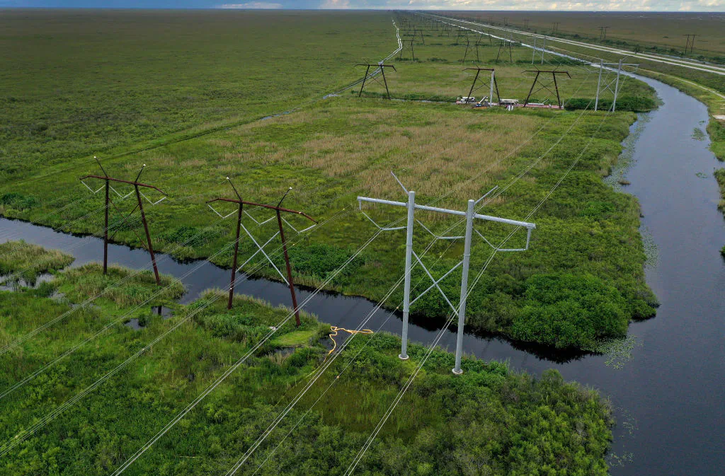 In an aerial view, electric power lines are seen attached to the transmission tower along the power grid in the Everglades, Fla., on Sept. 28, 2023. (Joe Raedle/Getty Images)