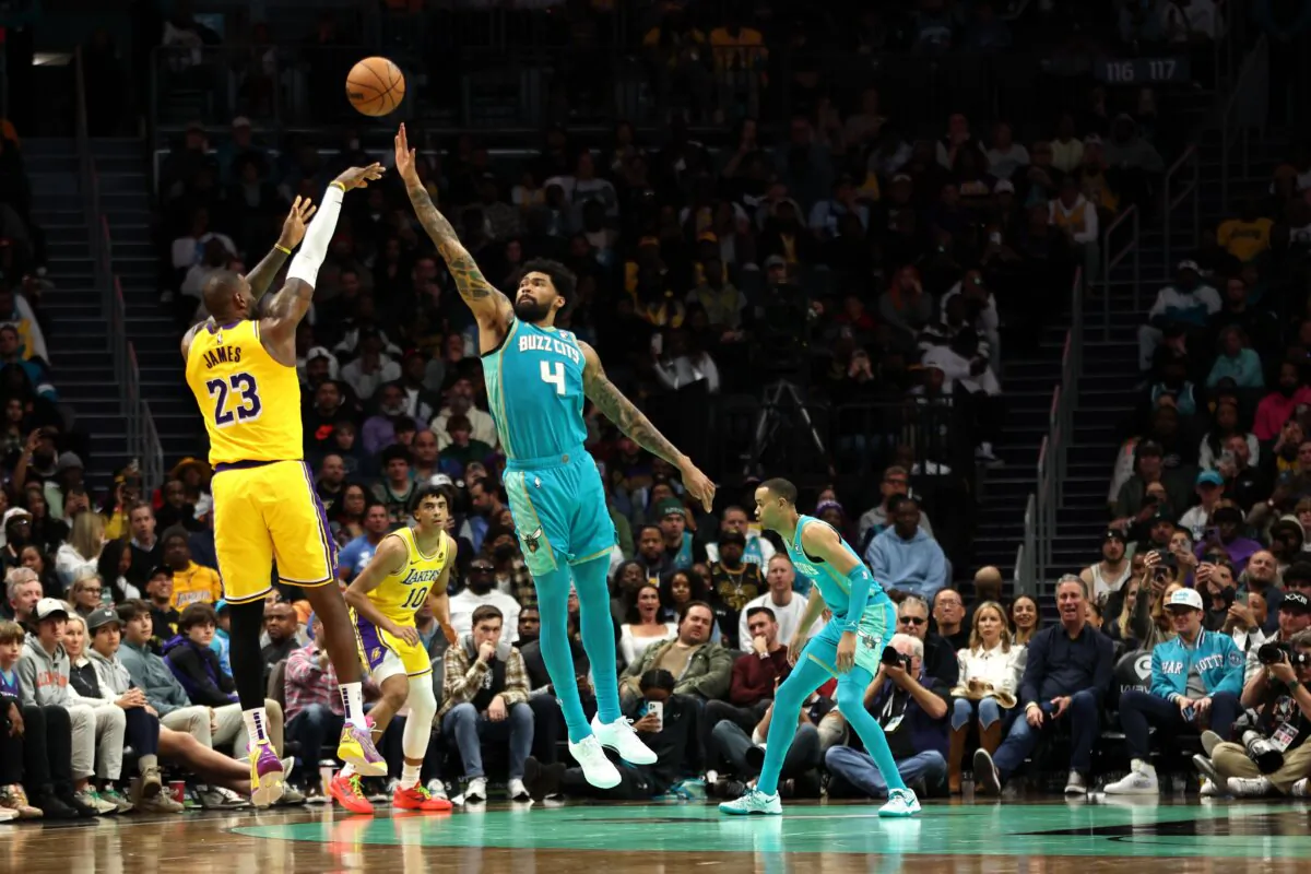 LeBron James (23) of the Los Angeles Lakers shoots the ball over Nick Richards (4) of the Charlotte Hornets during the second half of a game in Charlotte on Feb. 5, 2024. (David Jensen/Getty Images)